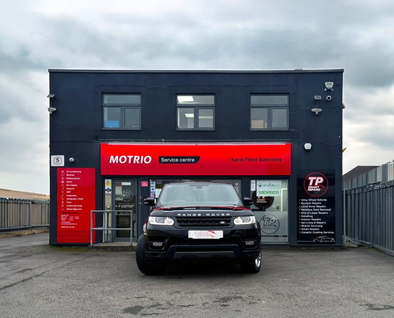 TP Smart Repairs - a black Range Rover outside the garage