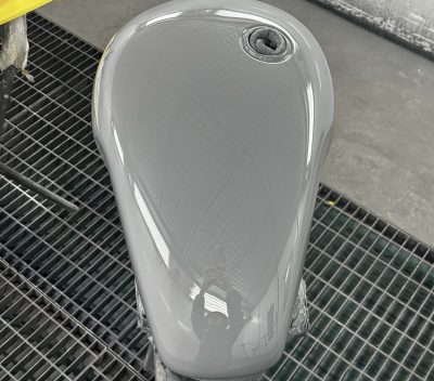 TP Smart Repairs - a finished grey motorcycle body panel that's been repaired and resprayed