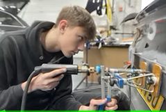 TP Smart Repairs technician, Callum, working on a car